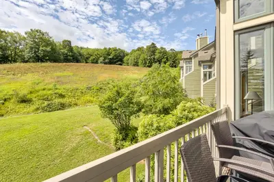 a balcony with a view of a yard at 2BR Slopeside in Chateau Ridge Blue Mountains in Blue Mountains