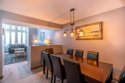 a dining room with a table and chairs at Blue Mountain Slopeside Chalet in Chateau Ridge in Blue Mountains