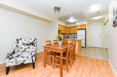 a kitchen and dining room with a table and chairs at PlanURstay - Ideal 2 BR & 2BTH 3888 Duke of York Blvd in Mississauga