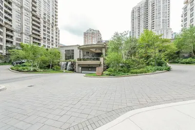 an empty parking lot in a city with tall buildings at PlanURstay - Ideal 2 BR & 2BTH 3888 Duke of York Blvd in Mississauga