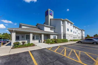 a building with a parking lot in front of it at Studio 6 Toronto - Mississauga with Kitchenettes in Mississauga