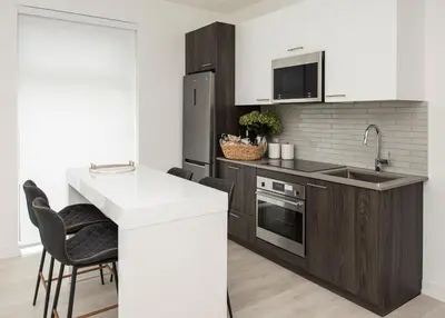 a kitchen with a sink and a stove top oven at Muskoka Bay Resort in Gravenhurst