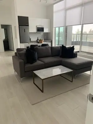 a living room with a couch and a coffee table at Muskoka Bay Resort in Gravenhurst