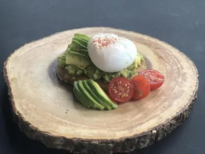 a plate of food with an egg and vegetables at Harrogate House Inn in Niagara on the Lake