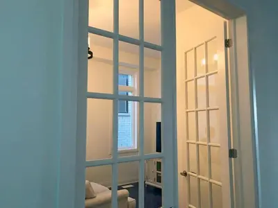 a door with a mirror in a room at Grand Waterfront Retreat under 1hr from Toronto in Bowmanville