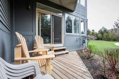 two chairs sitting on the porch of a house at Ski In Out 1 BR, Sleeps 6 Cachet Crossing in Blue Mountains