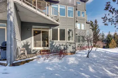 a house with a porch in the snow at Ski In Out 1 BR, Sleeps 6 Cachet Crossing in Blue Mountains
