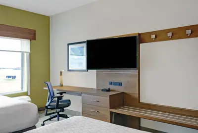 a hotel room with a desk and a tv at Holiday Inn Express & Suites - Port Elgin in Port Elgin