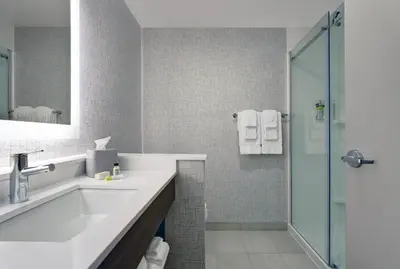 a bathroom with a sink and a shower at Holiday Inn Express & Suites - Port Elgin in Port Elgin