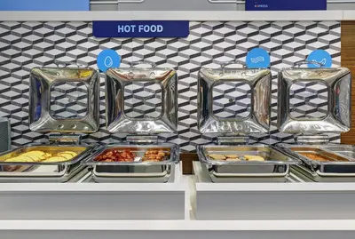 a bunch of trays of food on a display shelf at Holiday Inn Express & Suites - Port Elgin in Port Elgin