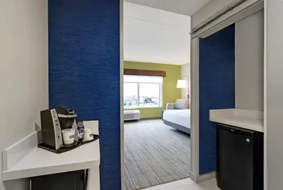 a view of a hotel room with a bedroom at Holiday Inn Express & Suites - Collingwood in Collingwood