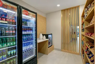 a refrigerator filled with lots of drinks in a store at Holiday Inn Express & Suites - Collingwood in Collingwood