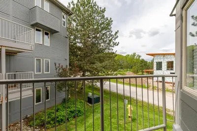 a balcony with a view of a yard at Condo at Blue Mountain on Ski Run Close to Village in Blue Mountains