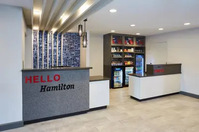 a hello hamilton store with a reception counter and a pharmacy at TownePlace Suites by Marriott Hamilton in Hamilton