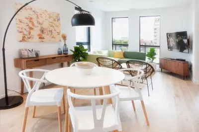 a living room with a white table and chairs at The Laundry Rooms - Waterloo in Waterloo