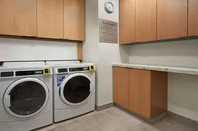 a kitchen with a washing machine and a counter at Fairfield by Marriott Inn & Suites Orillia in Orillia