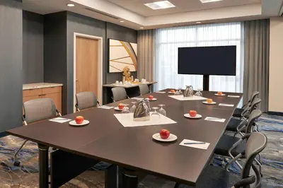 a conference room with a large table and chairs at Fairfield by Marriott Inn & Suites Orillia in Orillia