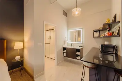 a small bathroom with a sink and a counter with a sink at Mercer Hotel Downtown; BW Premier Collection in Stratford