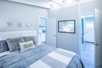 a bedroom with a bed with a pillow on it at 2BR Boutique Suite #8 in Blue Mountains