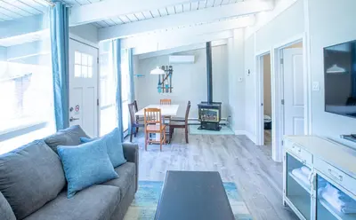 a living room with a couch and a table at 2BR Boutique Suite #8 in Blue Mountains