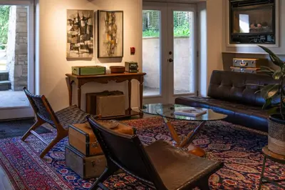 a living room with a couch and a table at The Kent Motel in Niagara on the Lake