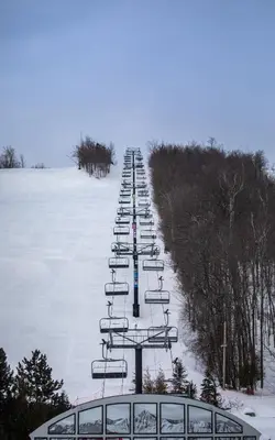 a line of ski lifts in the snow at Boutique Suite #6 in Blue Mountains