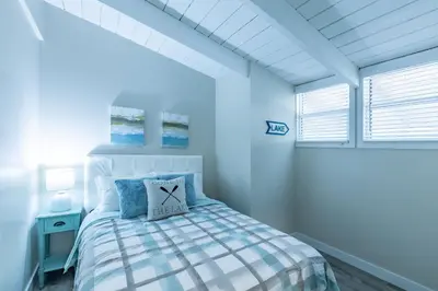 a bedroom with a bed with a pillow on it at Boutique Suite #5 in Blue Mountains