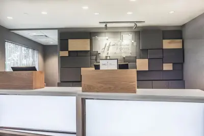 an office with a reception desk with a wall at Holiday Inn Express & Suites - Welland in Welland
