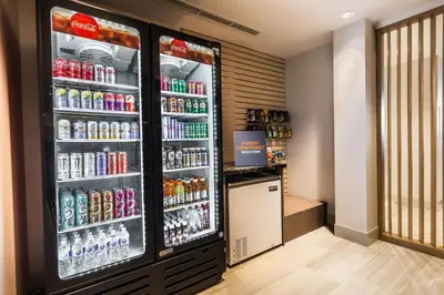 a large refrigerator filled with lots of drinks at Holiday Inn Express & Suites - Welland in Welland