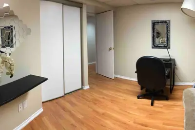 a room with a desk and a chair in it at 3 Spacious Bedroom Basement Apartment in Richmond Hill in Richmond Hill