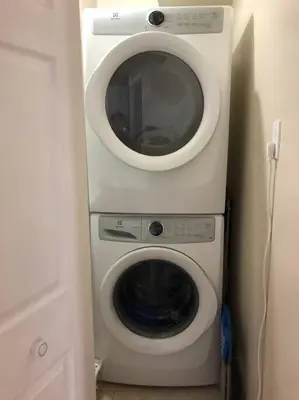 a washing machine and a dryer in a room at 3 Spacious Bedroom Basement Apartment in Richmond Hill in Richmond Hill