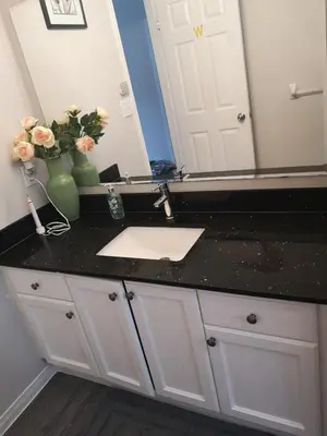 a bathroom counter with a sink and a mirror at Comfortable room B in Kitchener