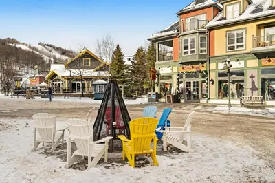 a group of chairs and a table in the snow at Snowbridge in Blue Mountains