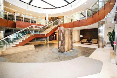 a lobby with a spiral staircase in a building at PlanURstay in Mississauga