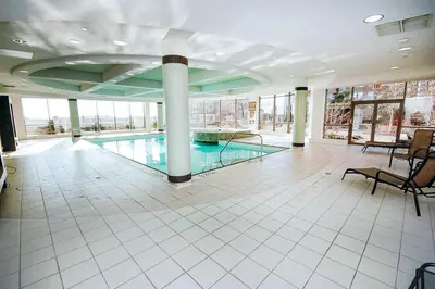 a large swimming pool in a building with a large room at PlanURstay in Mississauga