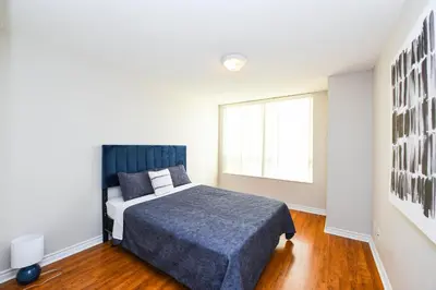 a bedroom with a bed and a window at PlanURstay in Mississauga