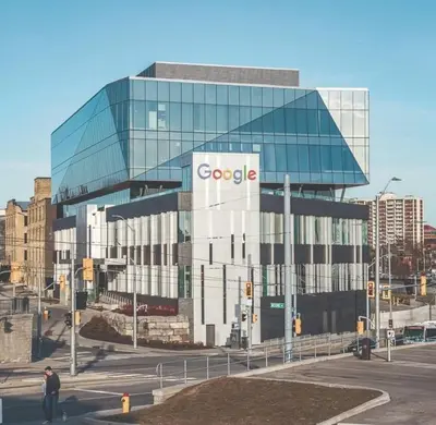 a large glass building with a google sign on it at ENTIRE 1 BEDROOM APARTMENT ACROSS FROM GOOGLE - br5 in Kitchener