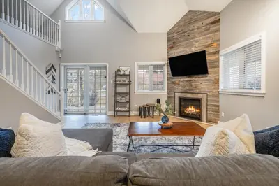 a living room with a couch and a fireplace at Luxurious Private House Pool and Hot Tub in Blue Mountains