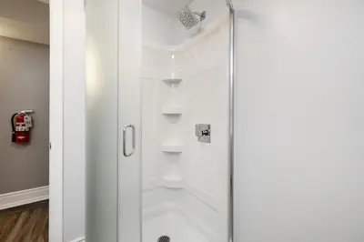 a shower with a glass door in a bathroom at Luxurious Private House Pool and Hot Tub in Blue Mountains