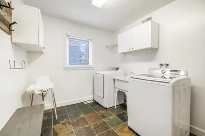 a laundry room with a washer and dryer at Luxurious Private House Pool and Hot Tub in Blue Mountains