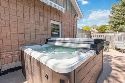 a hot tub on the side of a building at Luxurious Private House Pool and Hot Tub in Blue Mountains