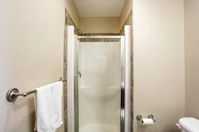 a bathroom with a shower and a toilet at 2 Bedroom Rivergrass with a View in Blue Mountains