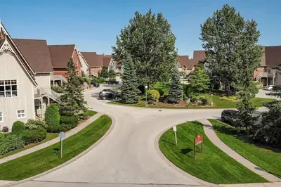 a winding road in a residential neighborhood at Blue Mountain 3 bedroom Dream Chalet 81590 in Collingwood