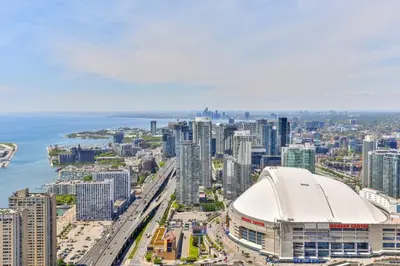 an aerial view of a city with a large building at Two BD CN Tower and Lake Ontario View in Toronto