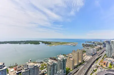 an aerial view of a city and a body of water at Two BD CN Tower and Lake Ontario View in Toronto
