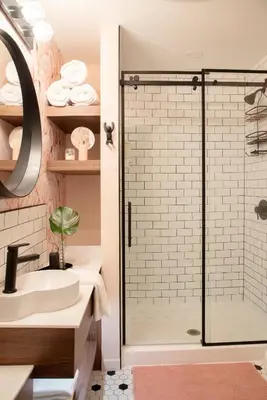 a bathroom with a shower and a sink at The Juniper Inn in St. Catharines