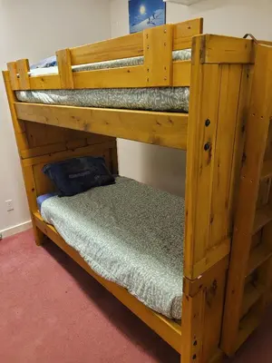 a couple of bunk beds in a room at Whispering Pines Suite at The Bowering Lodge in Blue Mountains