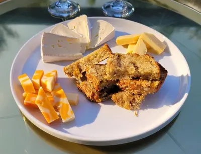 a plate of food with cheese and bread and cheese cubes at La Maison de Sophie in Niagara on the Lake