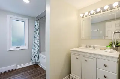 a bathroom with a sink and a mirror at Wintergreen Retreat with Private Sauna & Patio 82291 in Blue Mountains