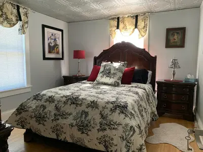 a bedroom with a large bed and a window at THE YORK HOUSE BOUTIQUE Stay in Fort Erie